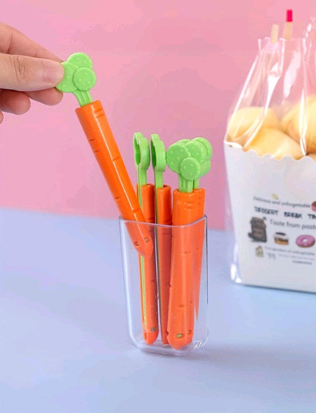 5 sealing tweezers in the shape of a cartoon carrot